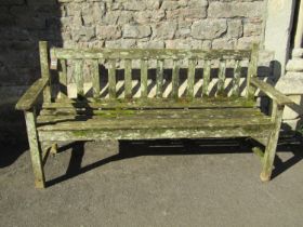 A vintage R A Lister weathered teak three seat garden bench with slatted seat and back, 159 cm wide