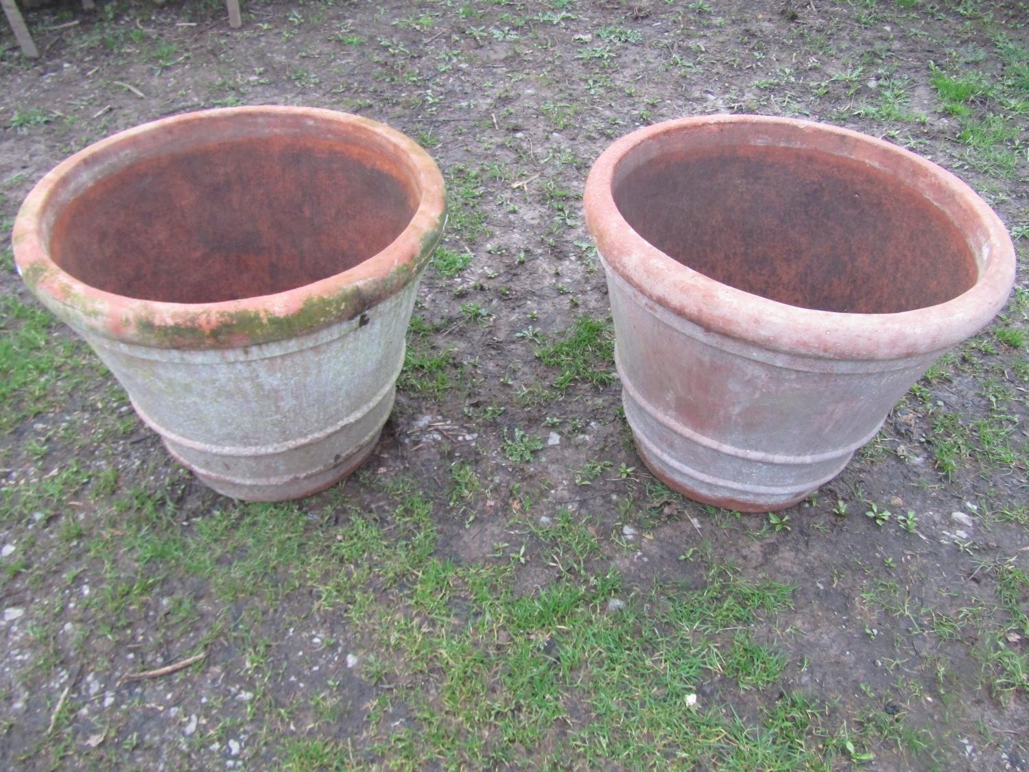 A pair of large weathered terracotta planters of circular tapered and simple ribbed form, 56 cm high - Image 4 of 6
