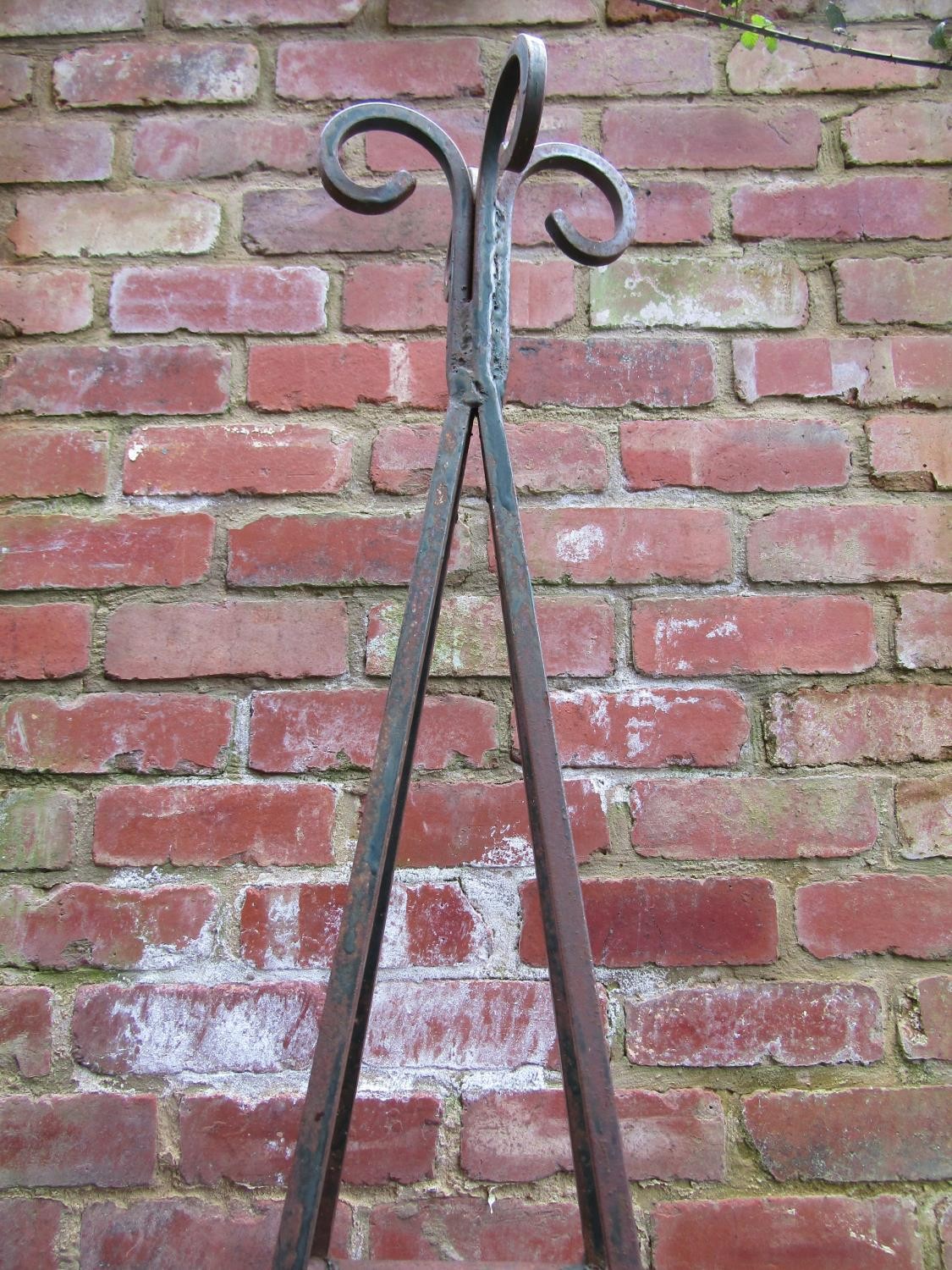 A weathered tall pyramid shaped steel garden obelisk with open scroll finial approx 240 cm high - Image 2 of 3