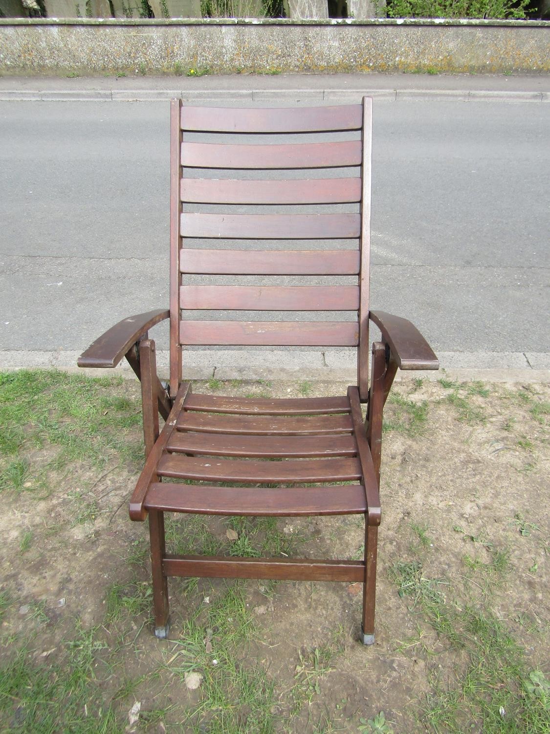 A stained and weathered hardwood garden suite comprising table with oval slatted top and single - Image 4 of 5