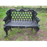 A good quality heavy gauge cast iron two seat garden bench with shaped outline and decorative