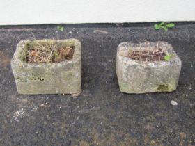 Two small rectangular weathered natural stone troughs, one 23cm high x 40cm x 30cm, the other