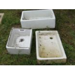 Three reclaimed white glazed butlers sinks of varying size and design, the largest 76 cm long x 50
