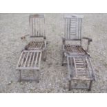 Two weathered teak folding steamer type chairs with slatted seats, backs and foot rests, with