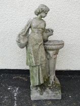 A small weathered cast composition stone garden ornament in the form of a maiden water carrier, 61