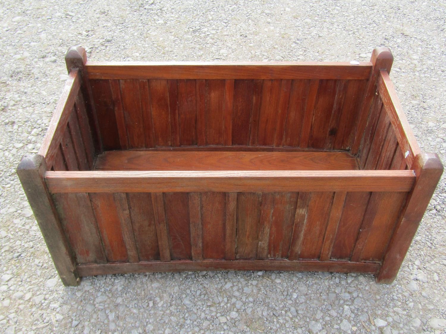 A pair of stained and weathered teak garden planters with facetted square cut supports and slatted - Image 4 of 7