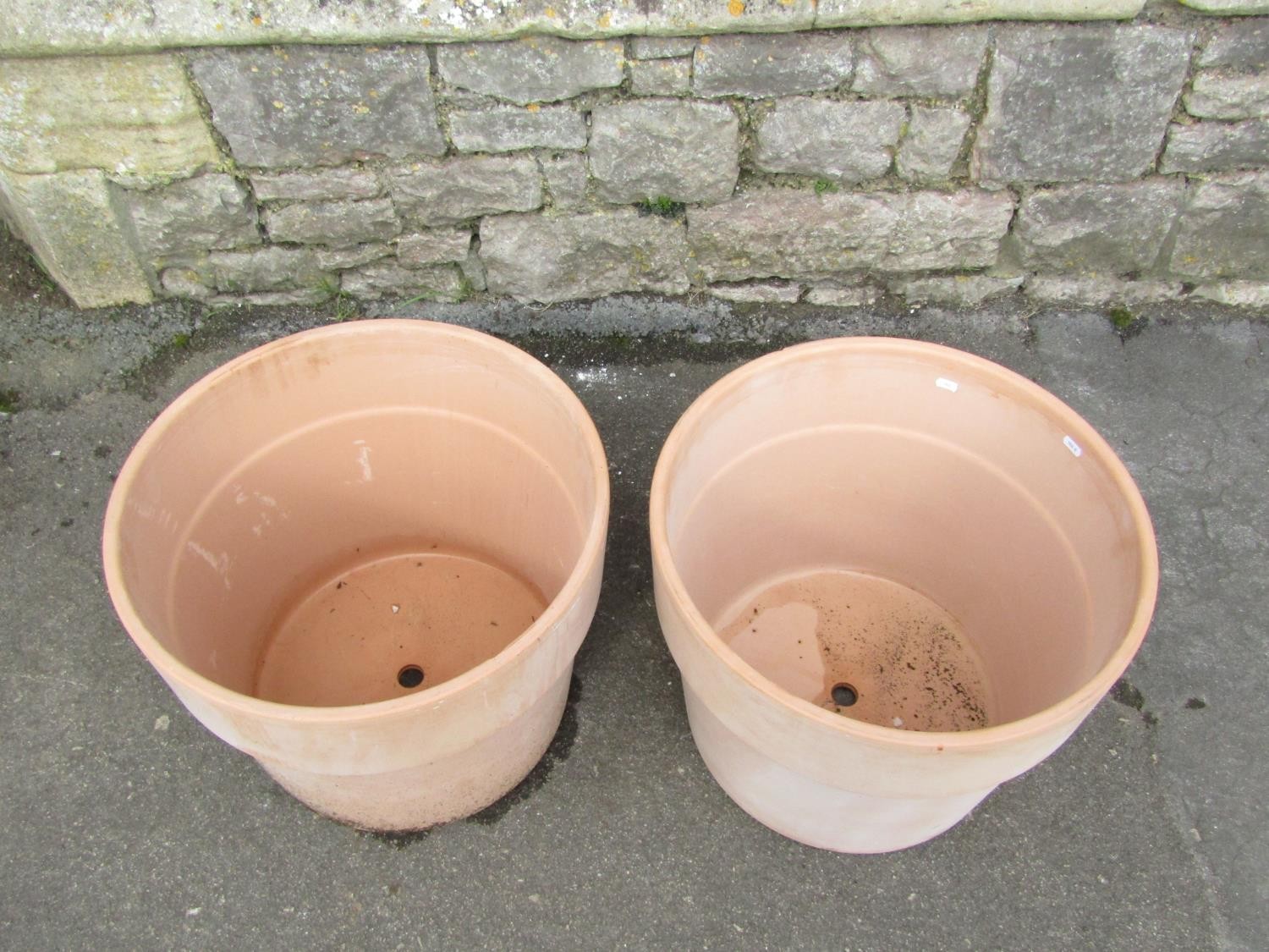 A pair of contemporary terracotta planters of circular tapered form with wide collars, 39m high x - Image 2 of 4