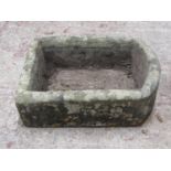A weathered rectangular natural stone trough with D shaped end, 18cm high x 62cm x 47cm