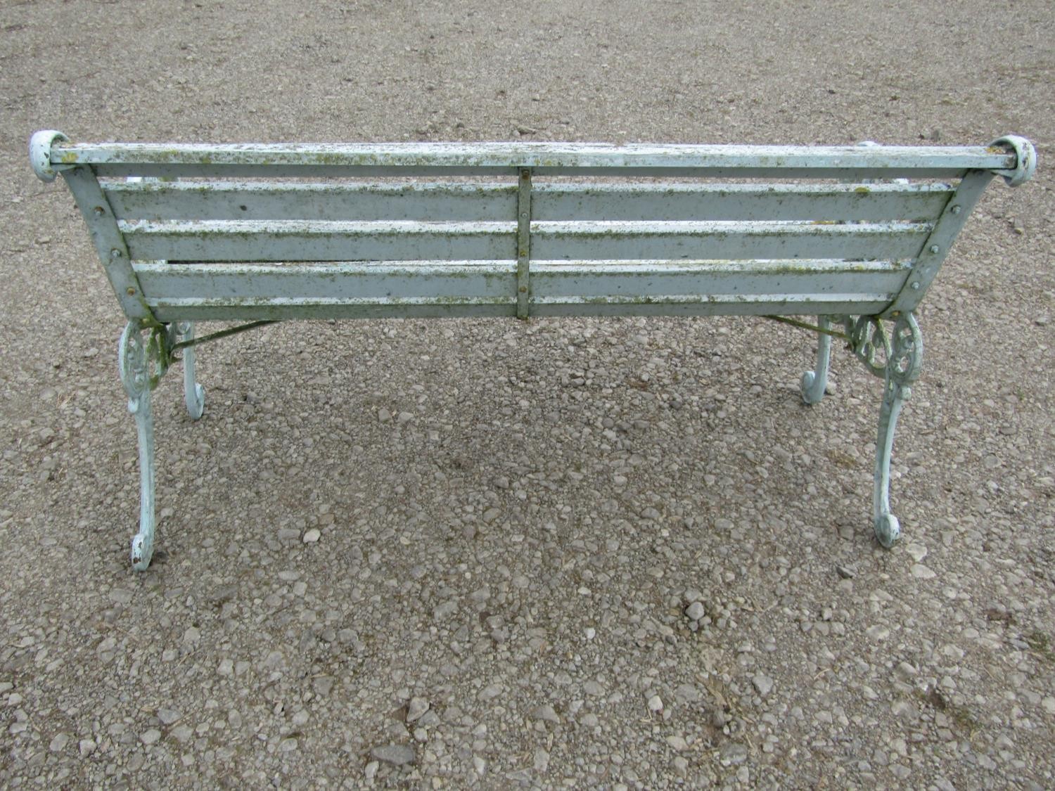 A weathered light blue/cream painted garden bench with slatted seat raised on decorative pierced and - Image 4 of 6