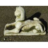 A weathered cast composition Sphinx terrace/pier ornament 50 cm high x 74 cm long x 29 cm wide