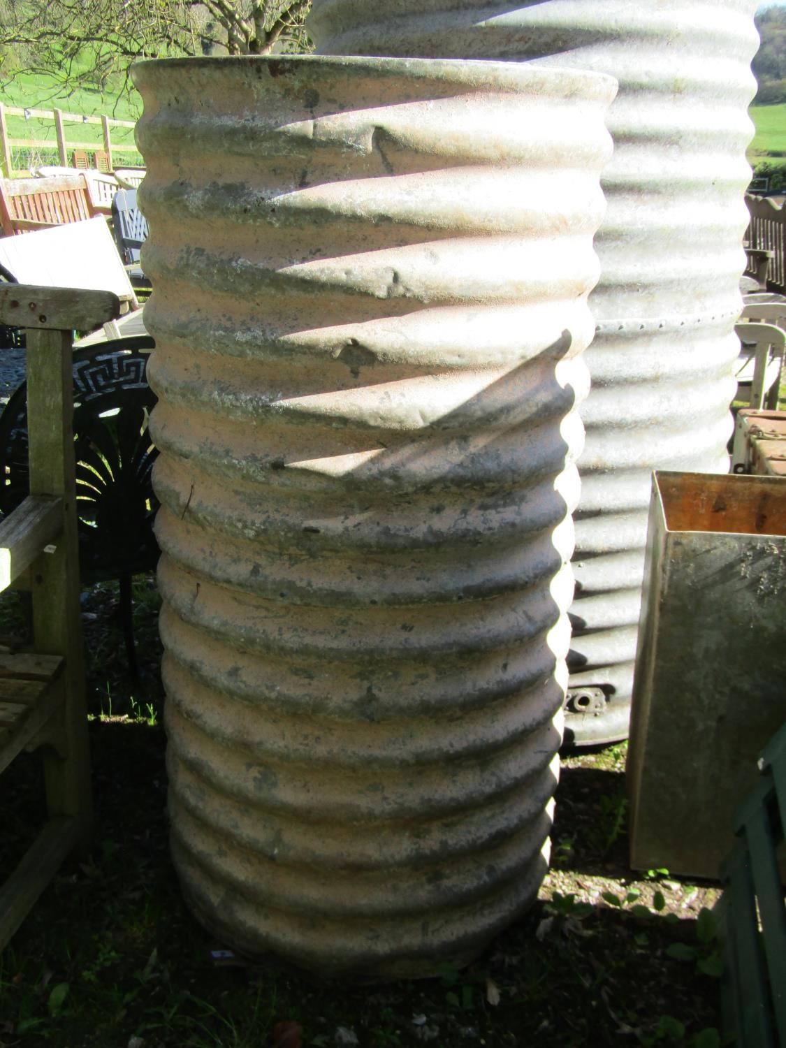 A small corrugated cylinder tank, 123cm high, 64cm diameter