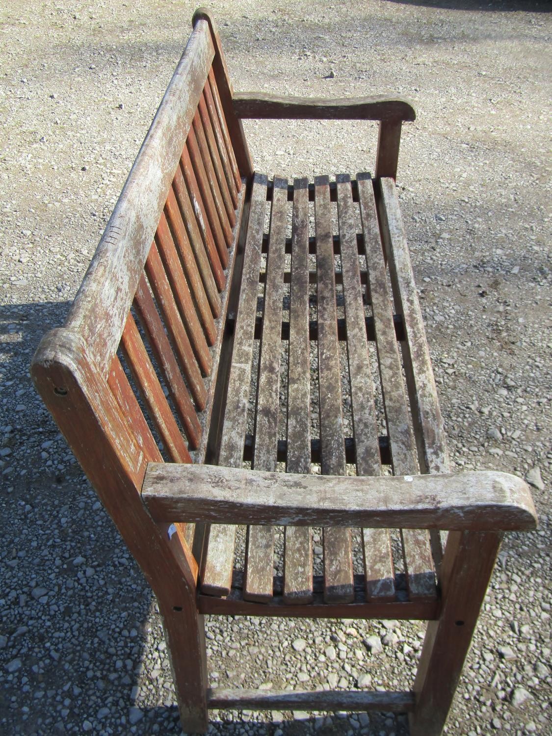 A pair of good quality heavy gauge weathered teak three seat garden benches with slatted seats and - Image 4 of 7