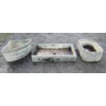 Three stone weathered cast composition garden troughs of varying size and design, the shallow