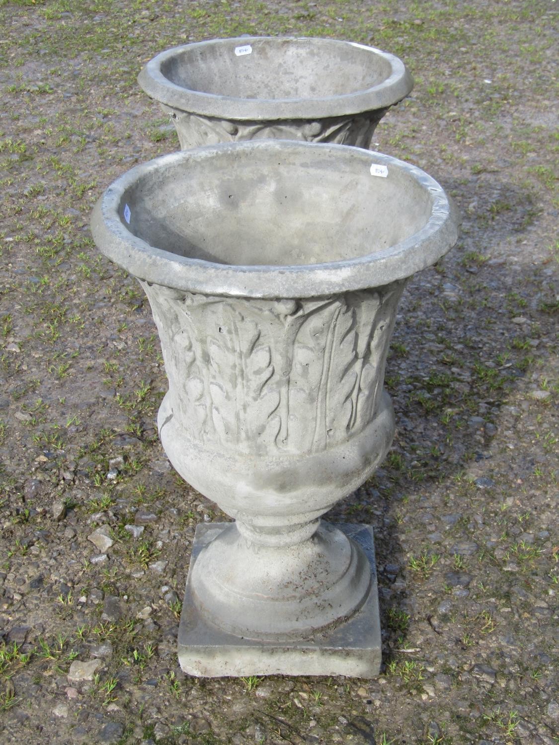 A pair of composition stone trumpet shaped garden urns, with moulded acanthus detail, raised on - Image 4 of 5