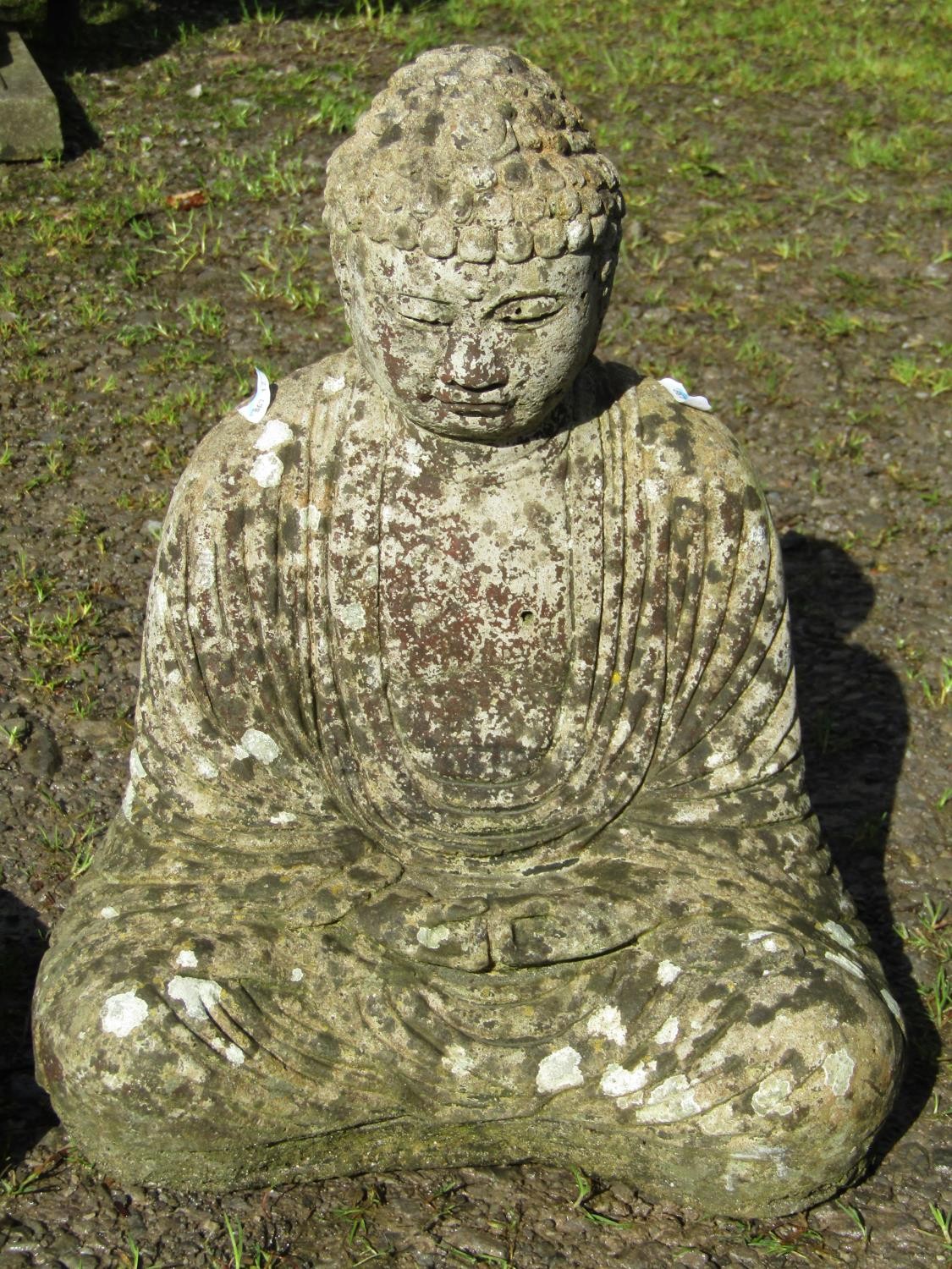 A cast composition stone garden ornament in the form of a seated Buddha in lotus position, raised on - Image 4 of 4