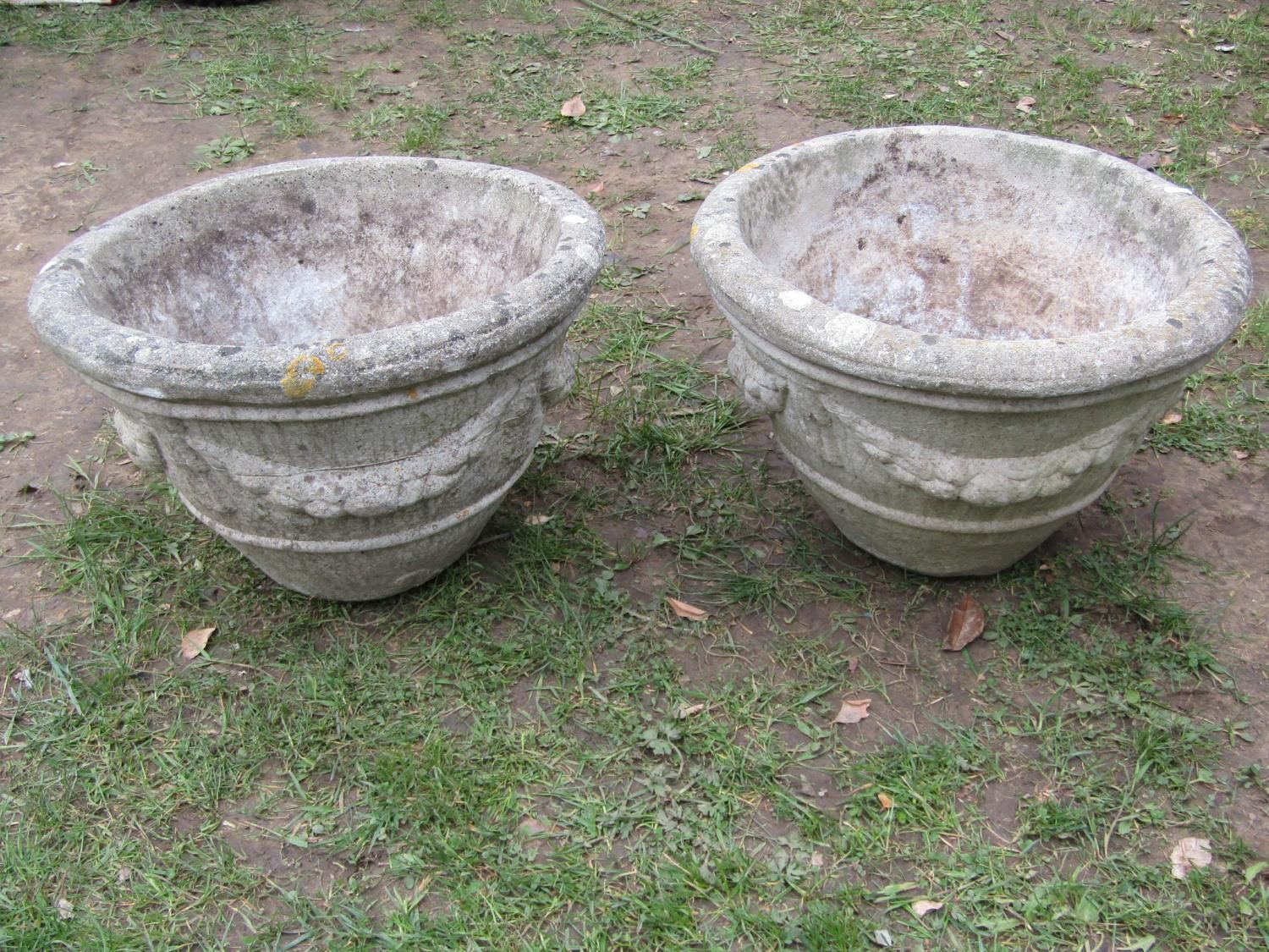 A pair of weathered cast composition stone garden planters of circular tapered form with fruiting - Image 3 of 3