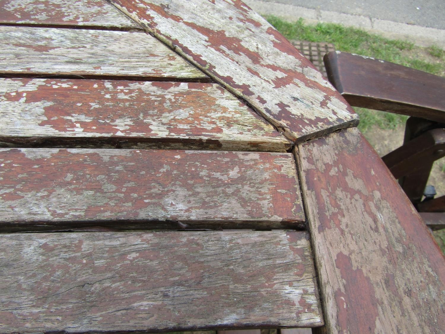 A stained and weathered hardwood garden suite comprising table with oval slatted top and single - Image 3 of 5