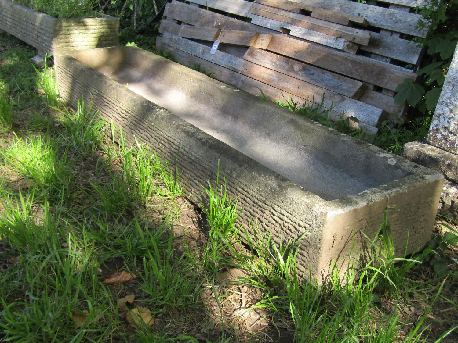 A weathered carved natural stone trough of rectangular form with slightly dished interior and - Image 2 of 3
