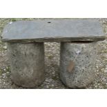 A pair of squat clylindrical polished Dartmoor granite pedestals 39 cm high x 26 cm diameter