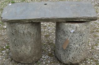 A pair of squat clylindrical polished Dartmoor granite pedestals 39 cm high x 26 cm diameter
