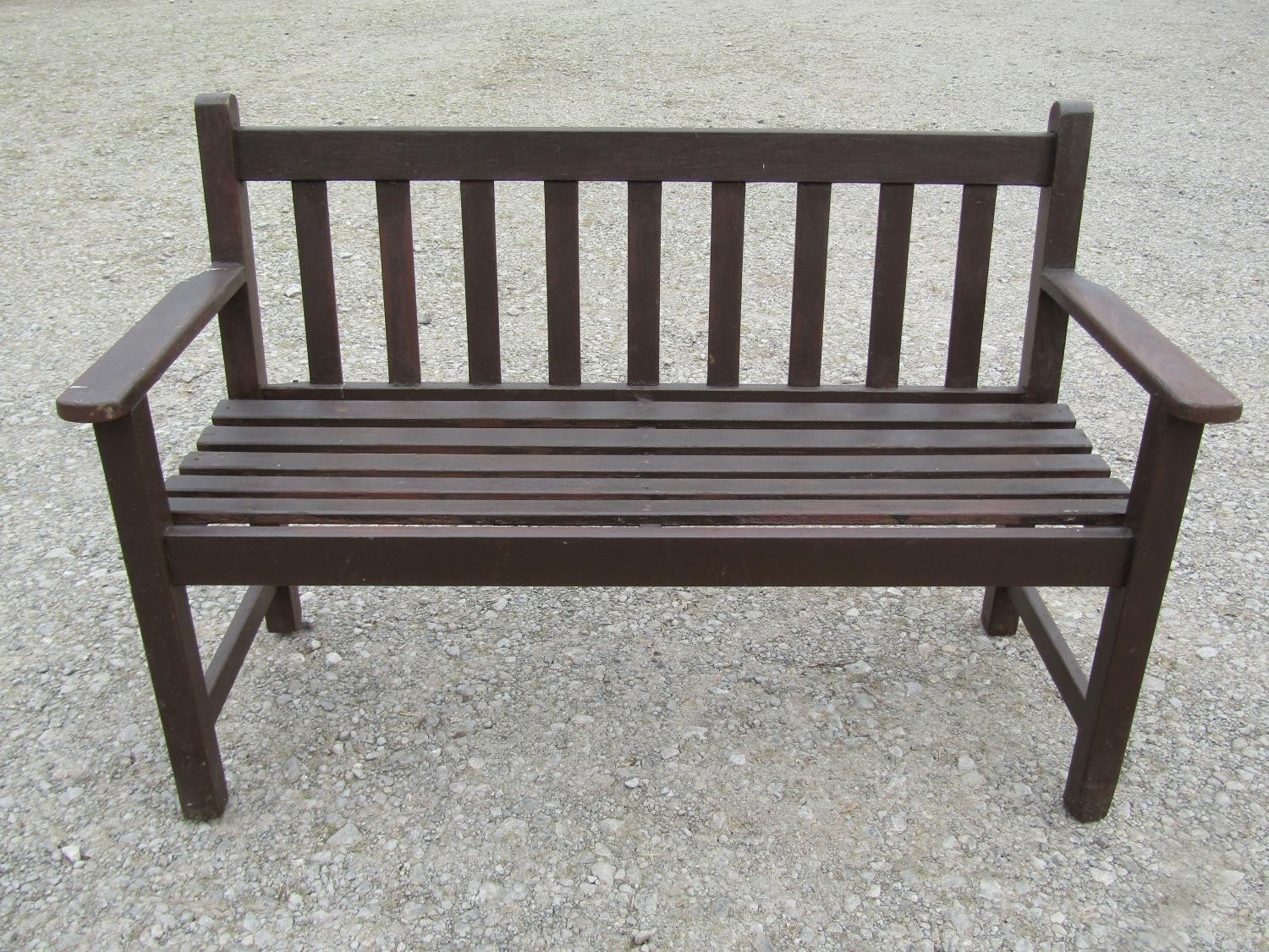 A Wrinch vintage stained teakwood two seat garden bench with slatted seat and back, 127 cm wide