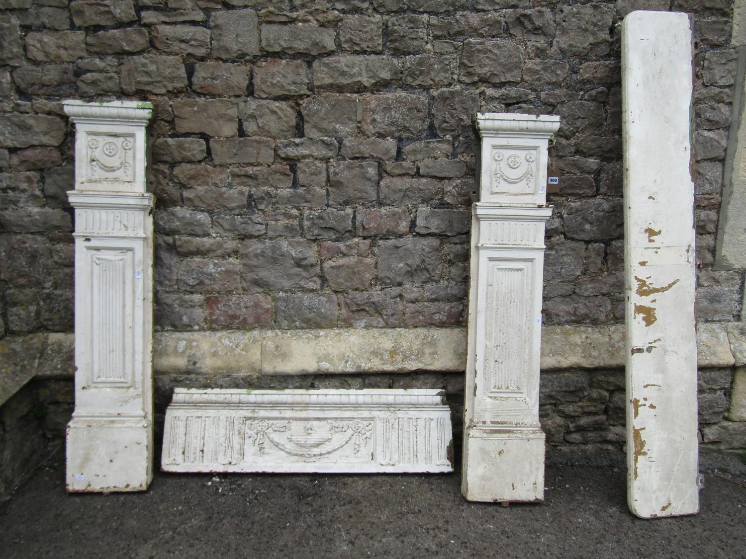 A Victorian cast iron fire surround with painted finish