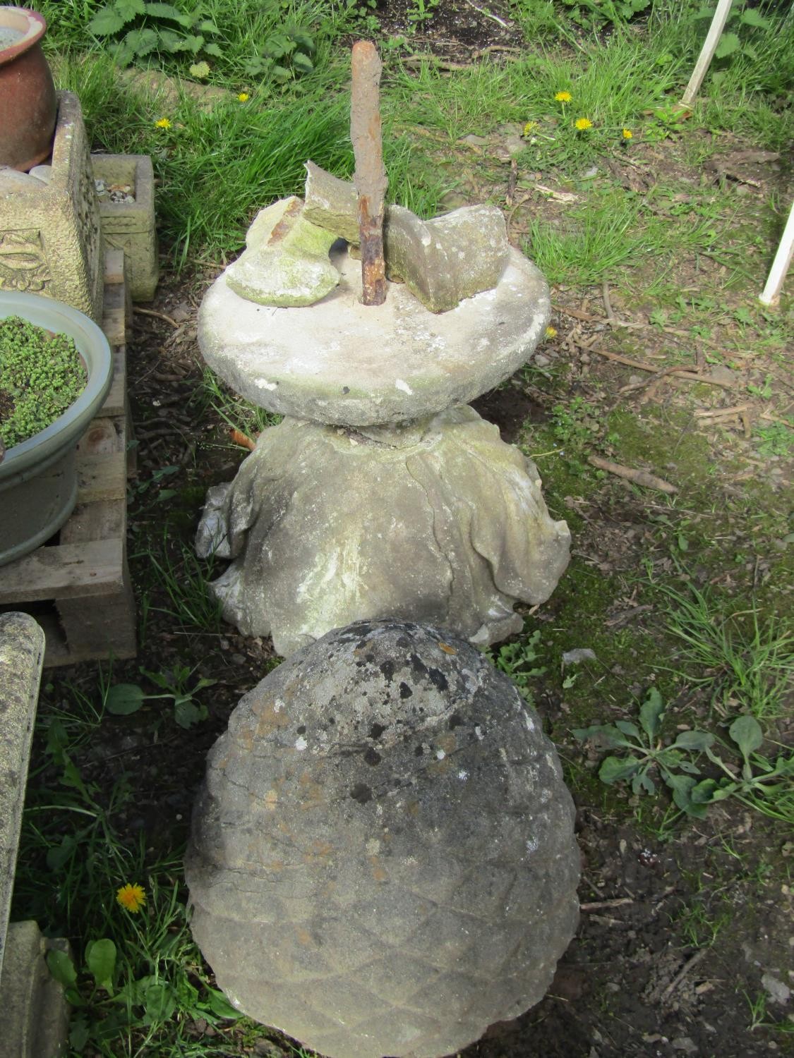 A weathered carved natural stone three-sectional pineapple finial, 75cm high approx (af)