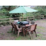 A contemporary weathered soft wood garden terrace suite comprising table with rectangular slatted