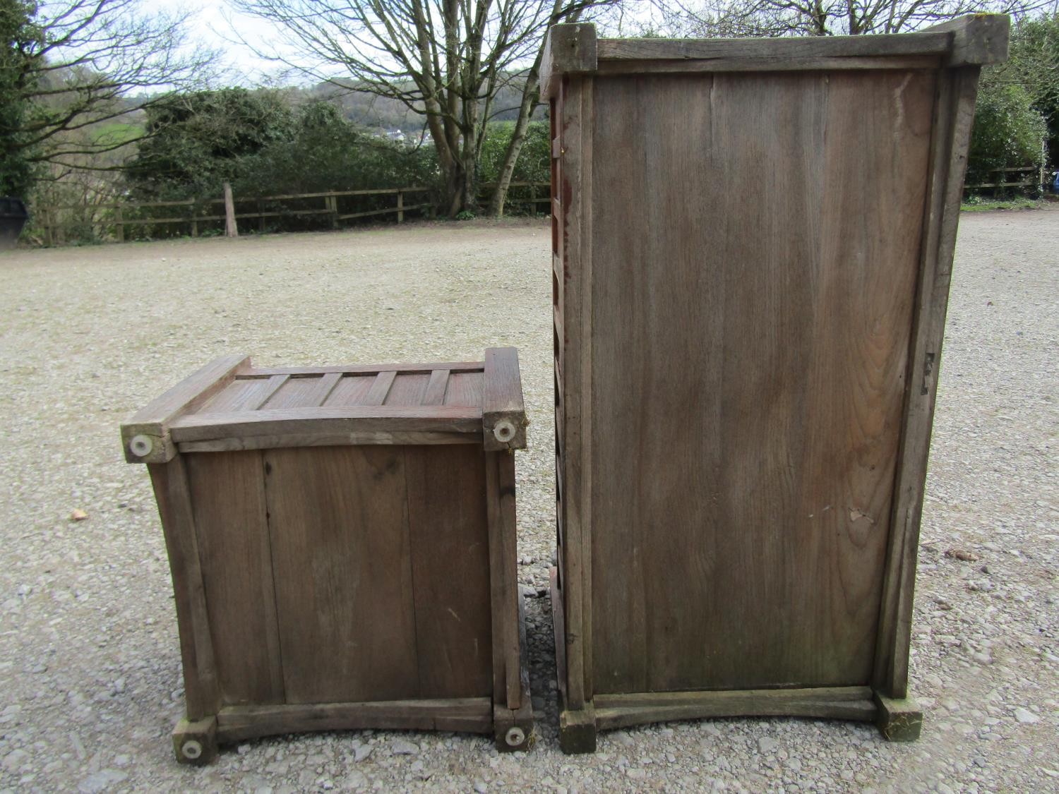 A pair of stained and weathered teak garden planters with facetted square cut supports and slatted - Image 5 of 7