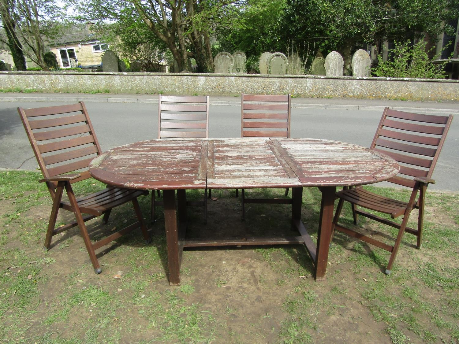 A stained and weathered hardwood garden suite comprising table with oval slatted top and single - Image 2 of 5