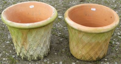 A pair of contemporary terracotta planters in the form of lattice baskets, 27 cm high x 32 cm