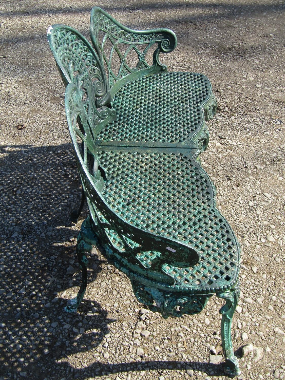 A weathered green painted cast alloy garden bench with shaped outline and decorative pierced - Image 6 of 10