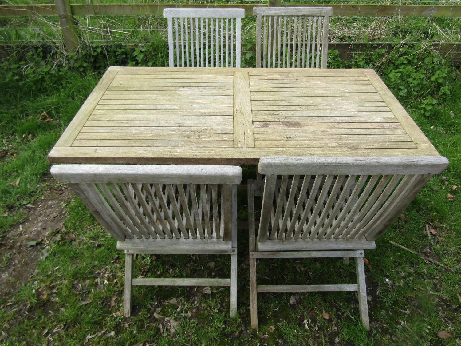 A Bramblecrest weathered teak folding garden table with rectangular slatted panelled top raised on x - Image 4 of 8