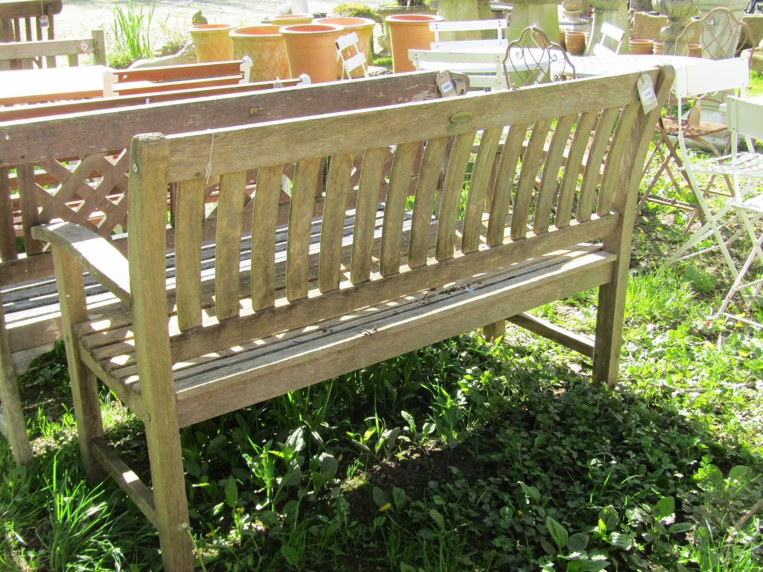 A weathered ‘Canterbury Collection’ teak garden bench with curved slatted seat, back and arms (AF) - Image 3 of 3