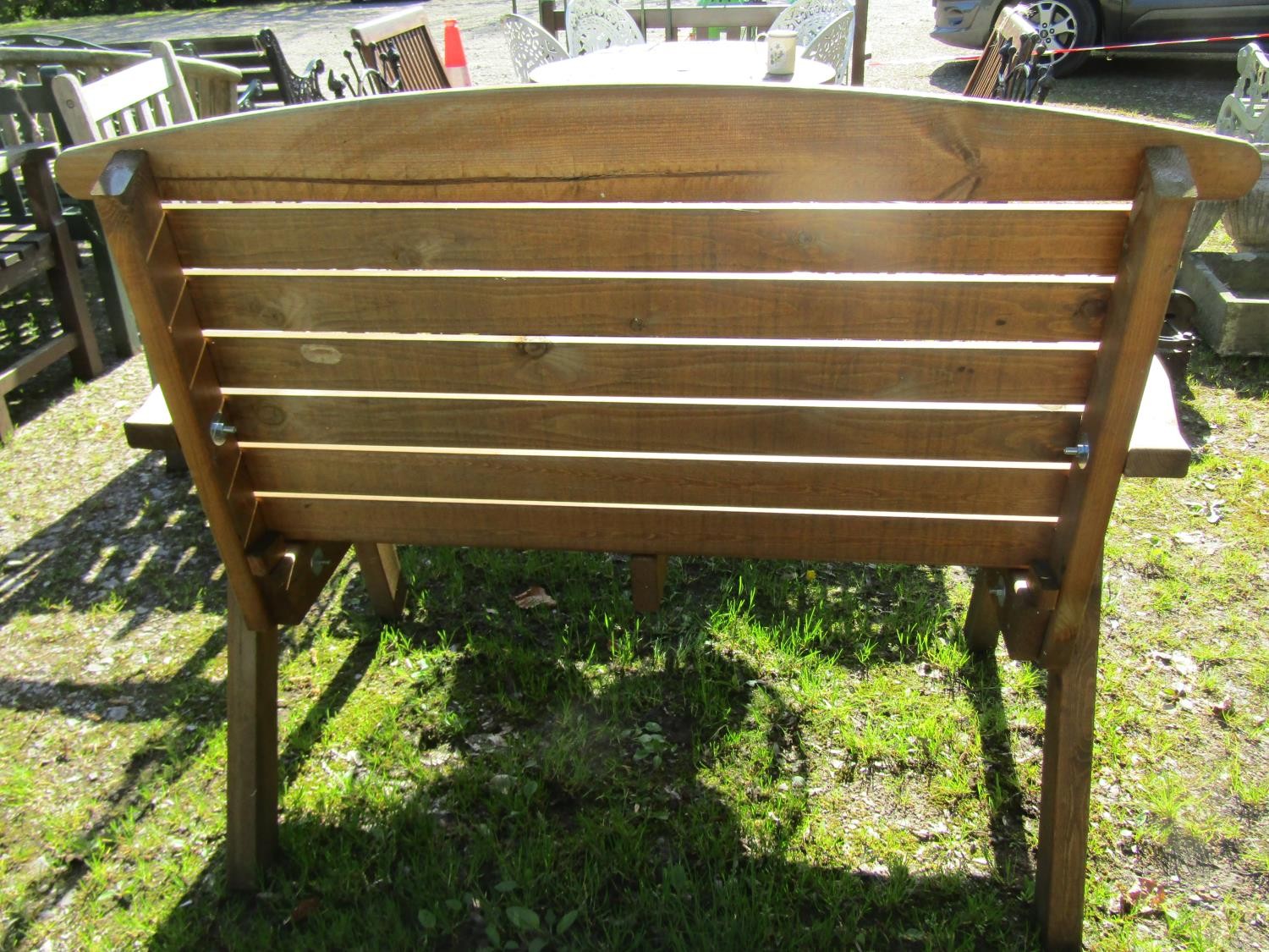 A contemporary weathered softwood 2 seat garden bench with slatted seat and back raised on splayed - Image 3 of 3