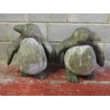 A pair of large novelty weathered novelty garden chain saw art carved wooden ornaments in the form