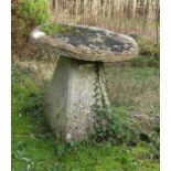A substantial limestone staddle stone and base, the top of flat form, 80 cm diameter x 80 cm