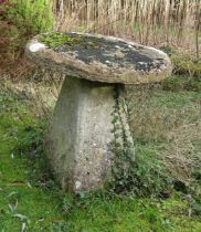 A substantial limestone staddle stone and base, the top of flat form, 80 cm diameter x 80 cm