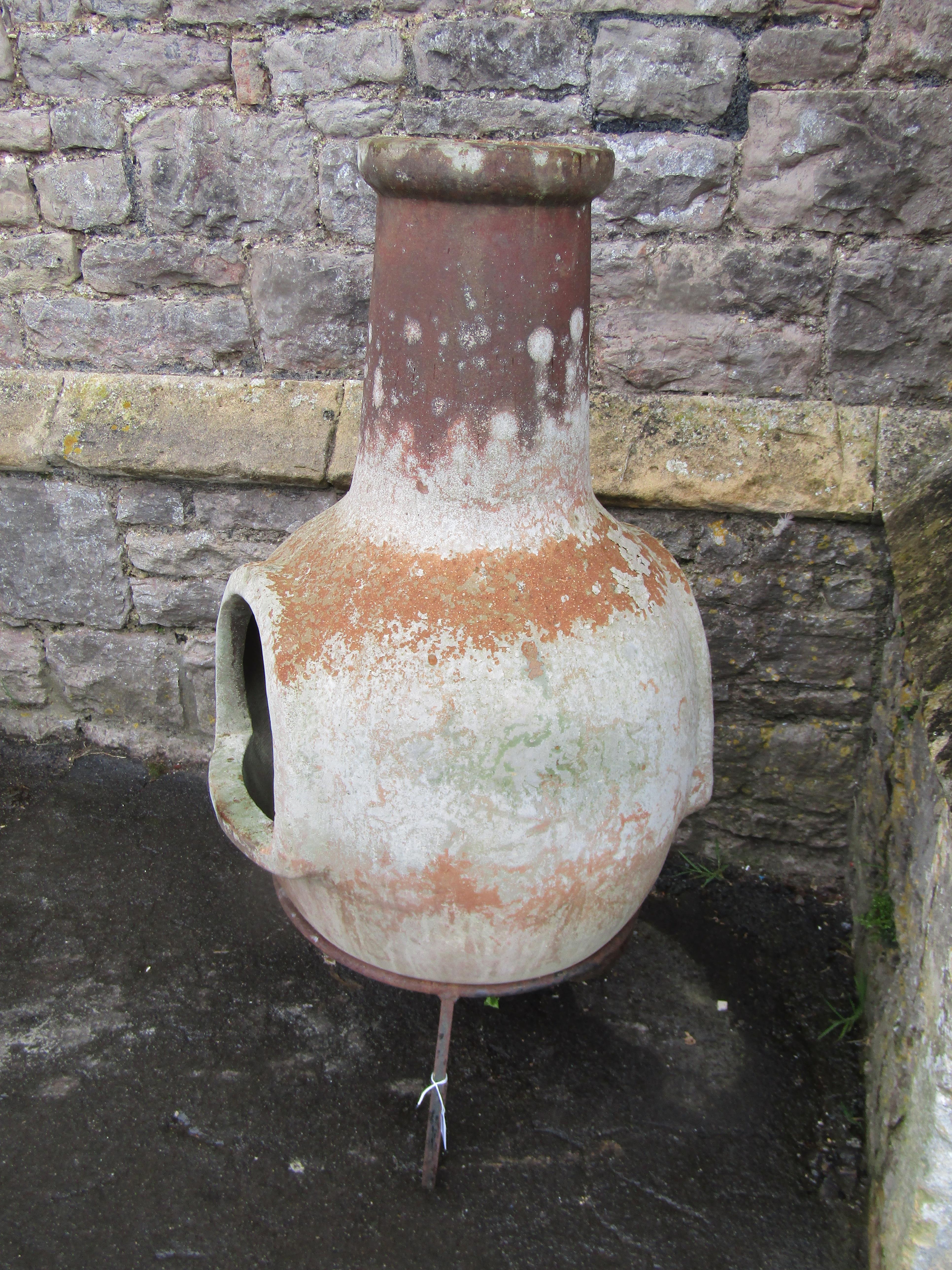A large weathered clay chimenea raised on a simple steel stand, 107 cm high - Image 3 of 3