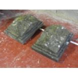 A pair of nicely weathered cast composition stone pier caps of stepped rectangular and squat pyramid