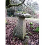 A limestone staddle stone and cap, 80 cm height