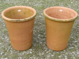 A pair of tall terracotta flower pots with moulded rims and incised Yorkshire flower pots, 38 cm