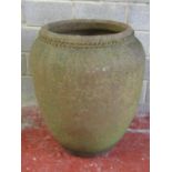A large weathered terracotta oviform jar/planter with crimp banded neck, 87 cm high x 76 cm diameter