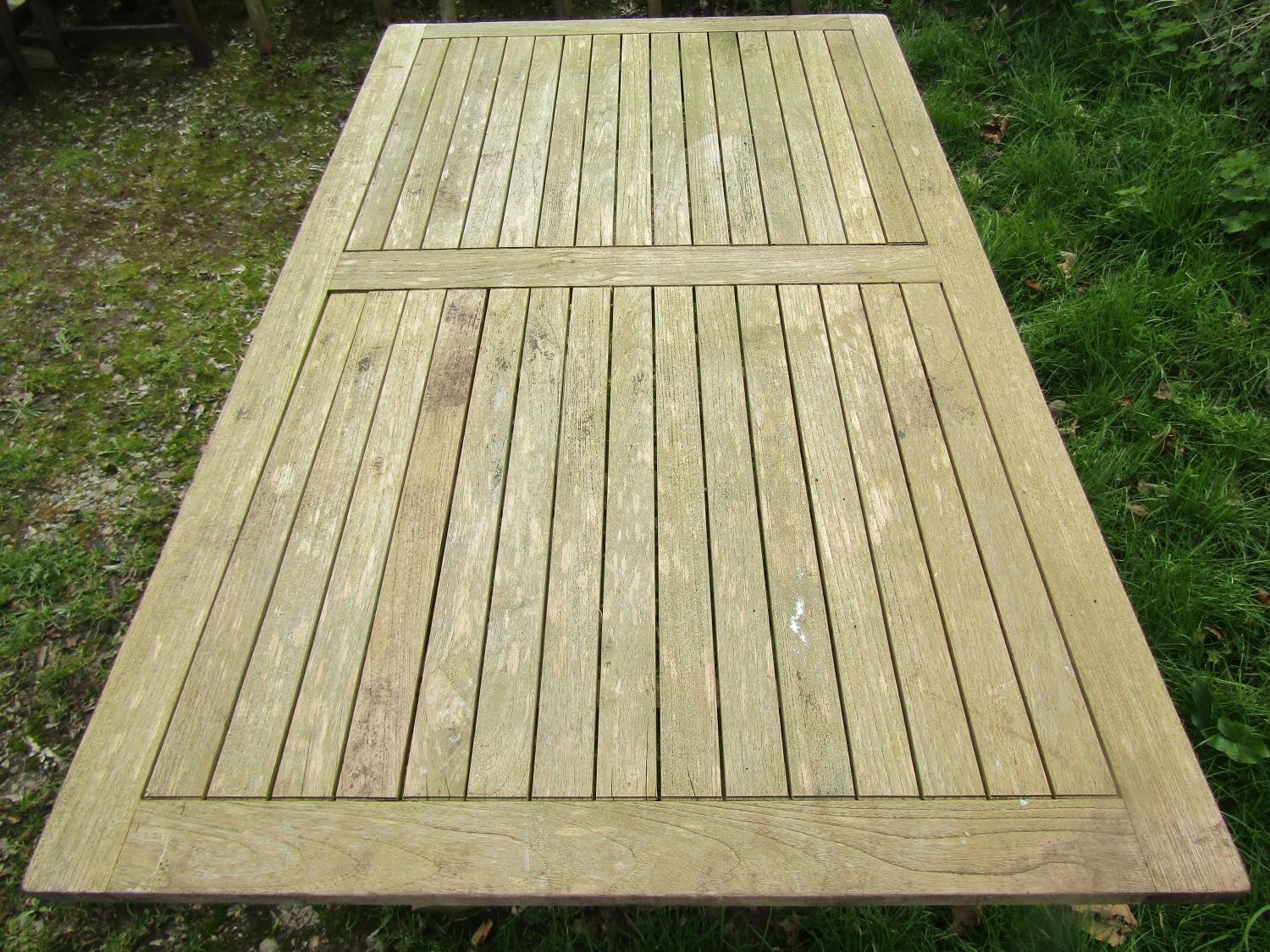 A Bramblecrest weathered teak folding garden table with rectangular slatted panelled top raised on x - Image 6 of 8