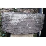 A local stone D end trough with carved detail, 58 cm long x 58 cm wide x 24 cm high
