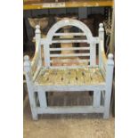 A weathered teak garden chair with worn pale blue painted finish. Wide generous slatted seat &