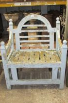 A weathered teak garden chair with worn pale blue painted finish. Wide generous slatted seat &