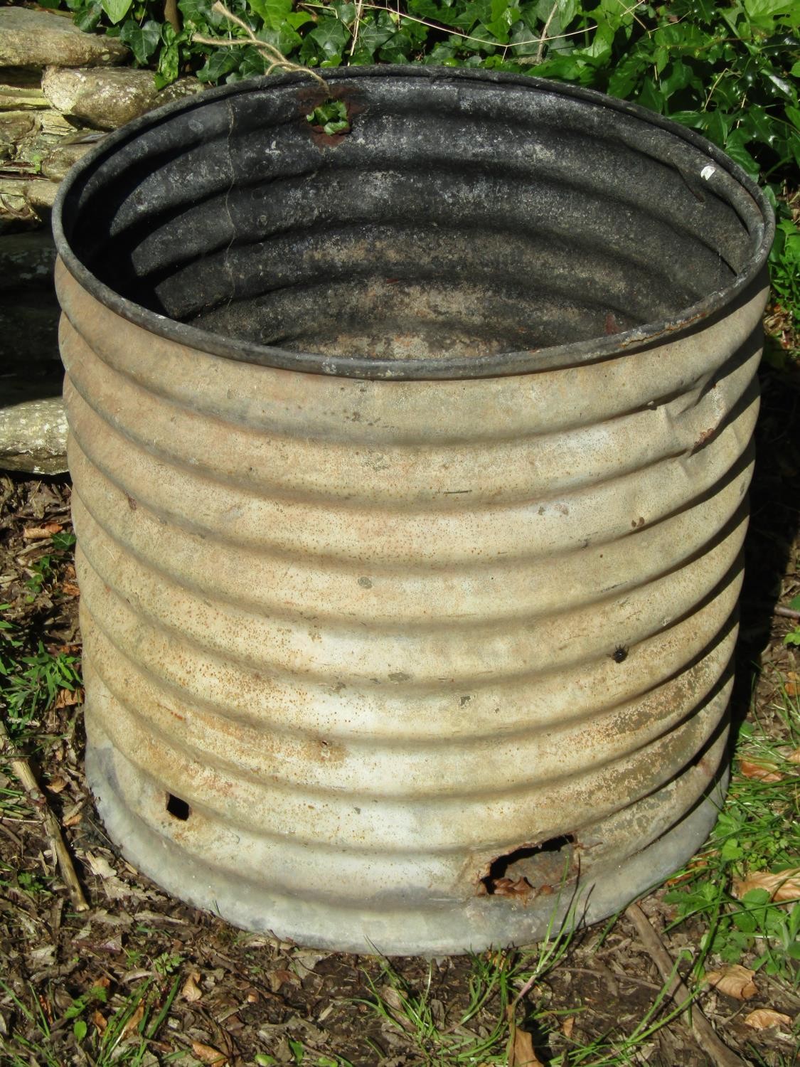 A corrugated galvanised tank, later, use that as a planter or possibly incinerator, 53cm high,