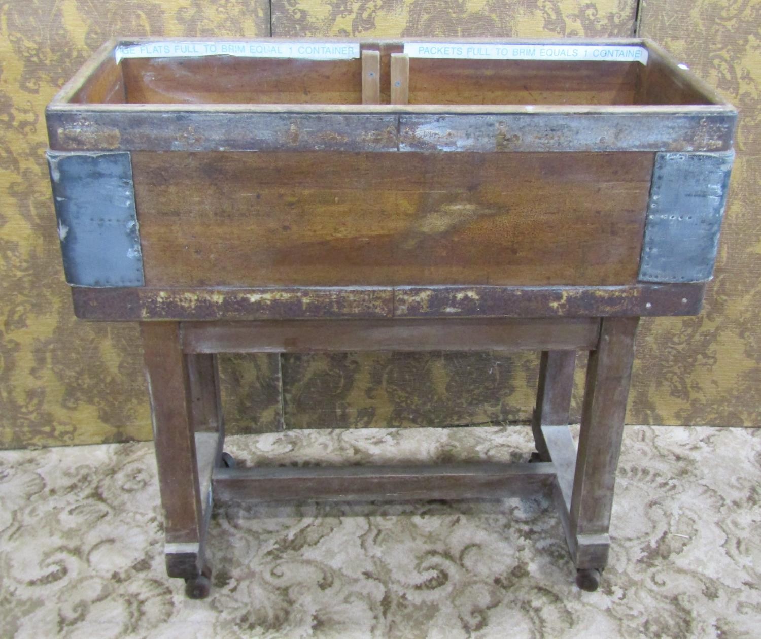 A vintage GPO (General Post Office) industrial sorting hopper, in banded pine on a wheeled trestle