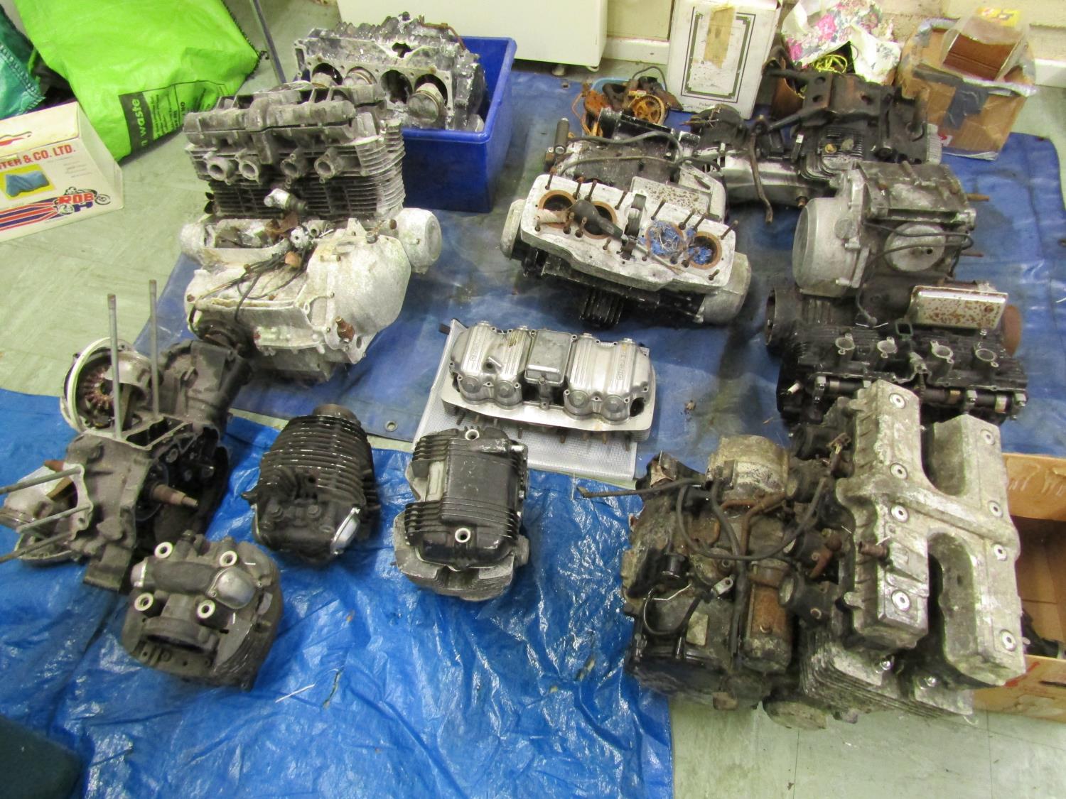 Five motorcycle engine/blocks, together with various cylinder heads etc